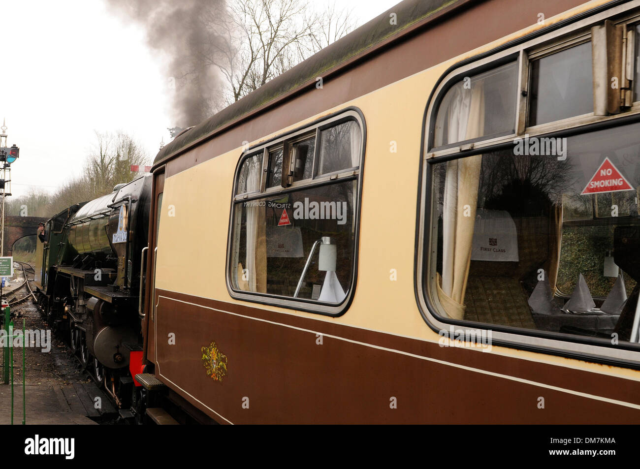 Steam train pulling out of  a station Stock Photo