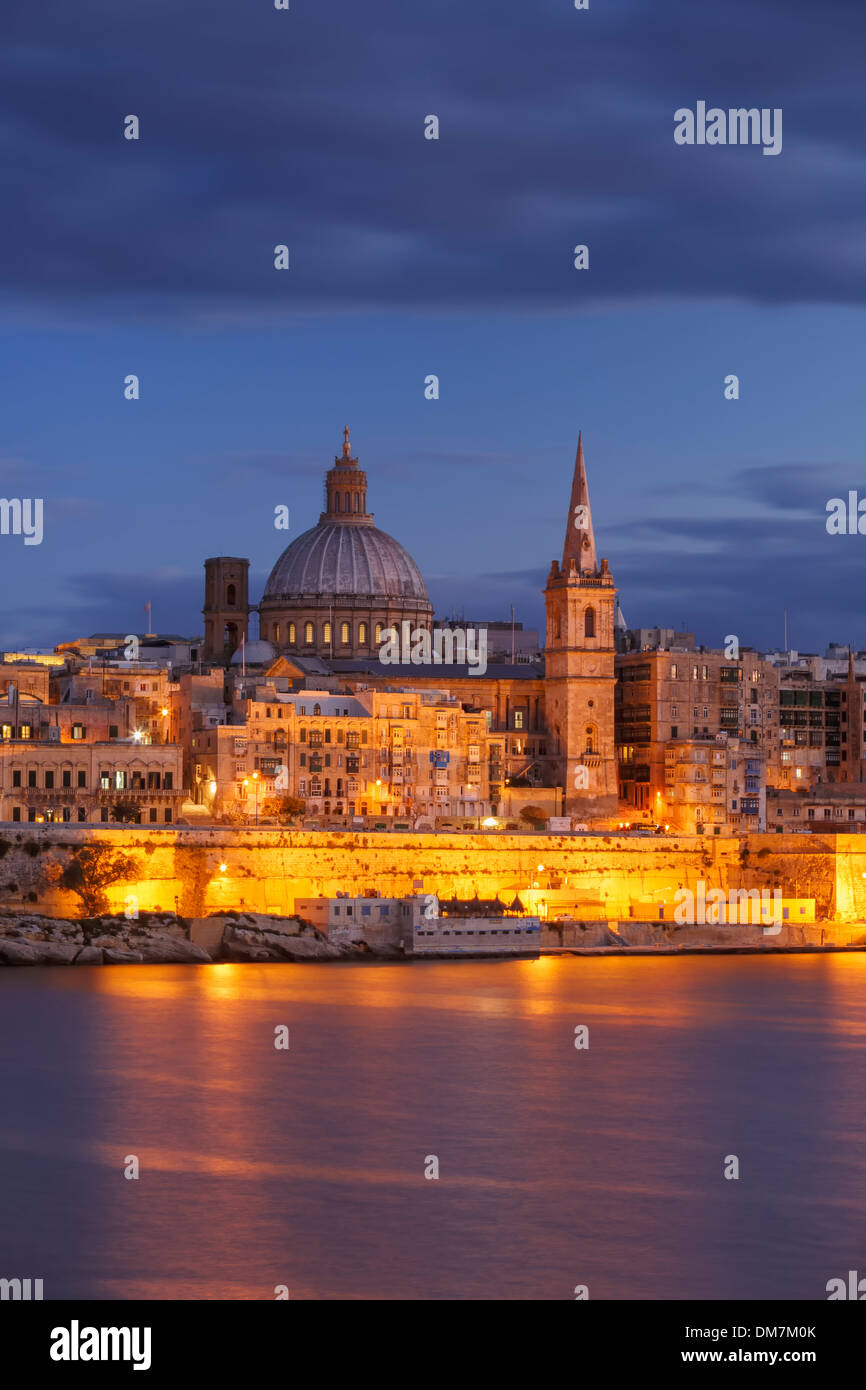 Malta, Valletta, skyline with St. Paul's Anglican Cathedral and Carmelite Church at dusk from Sliema Stock Photo