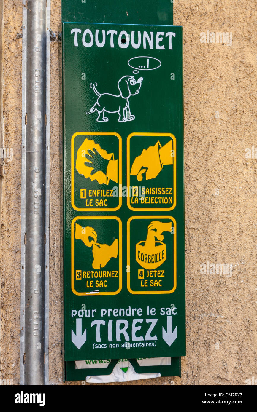 Dog mess bag dispenser in the village of Beaufort, Savoie, France Stock Photo