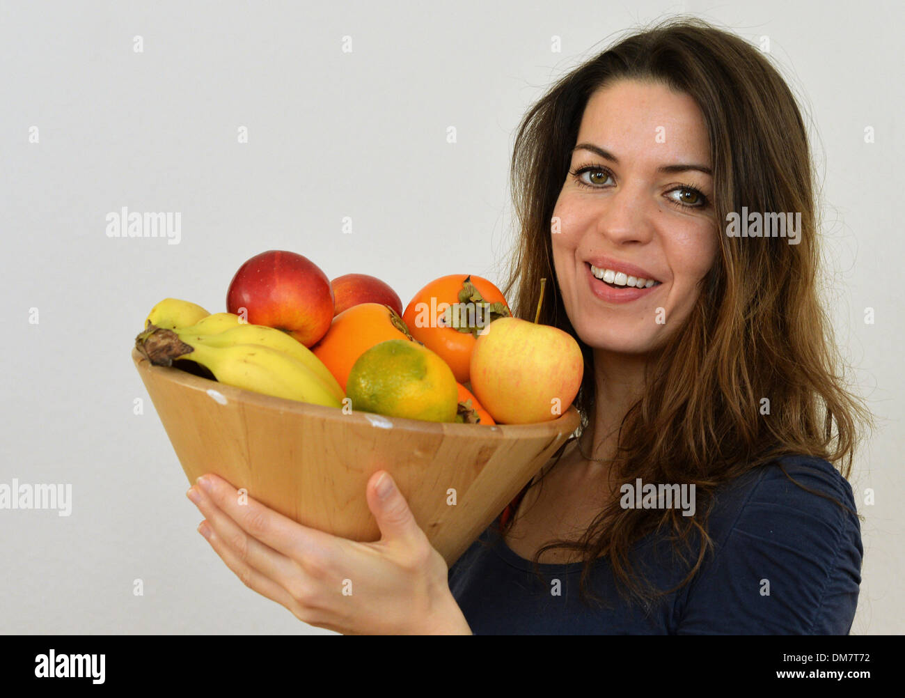 A young with a fruit bowl is photographed in Berlin, Germany, 02