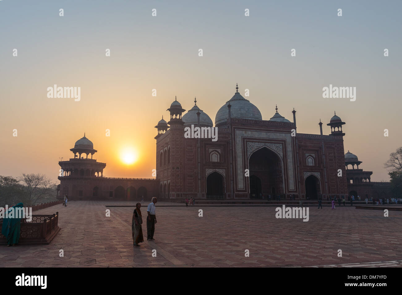 The stunning indo-islamic architecture of the Taj Mahal is complimented by the soft sunrise light over the palace in Agra, India. Stock Photo