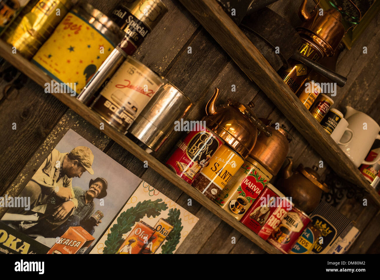 Old coffee and tea tins racked on wooden shelves Stock Photo - Alamy