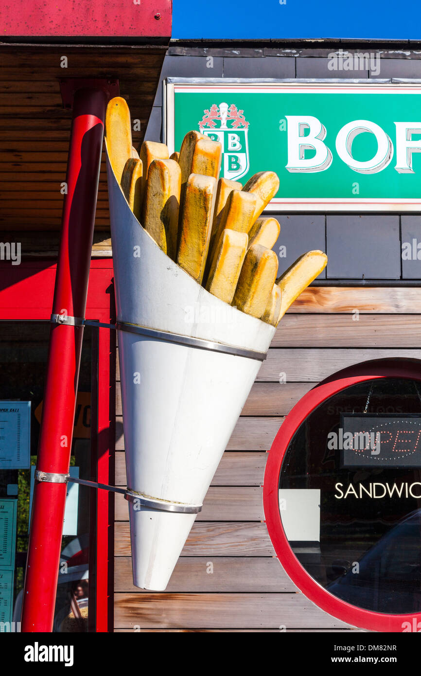 Giant packet of chips outside a fast food service station in Belgium Stock Photo