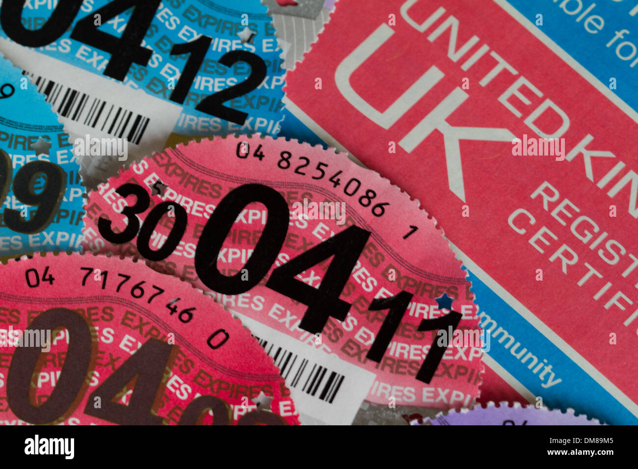 Car Registration Certificate with Various Car Tax Discs 2007 to 2013 Stock Photo