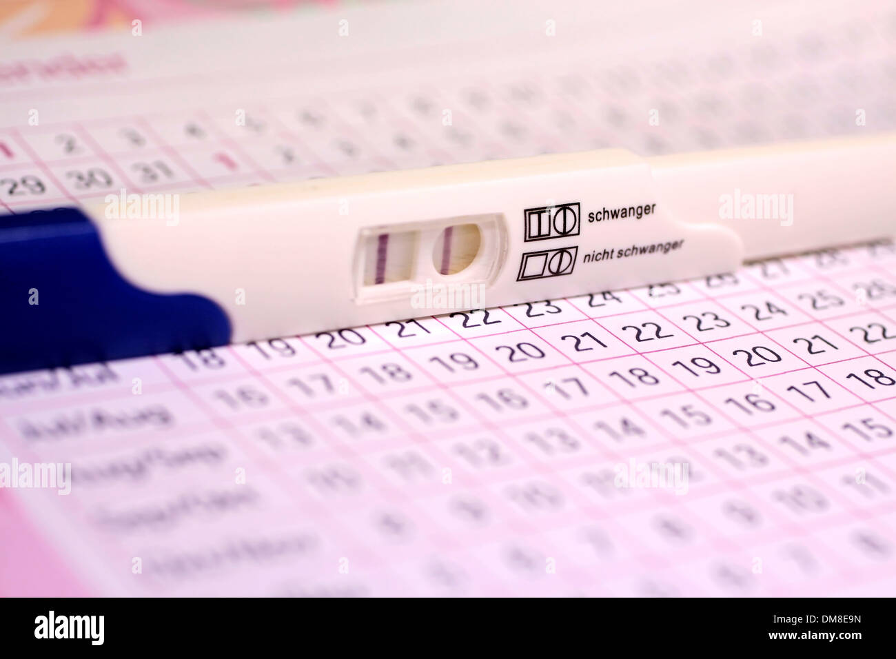 Close up of pregnancy test and cycle calendar Stock Photo