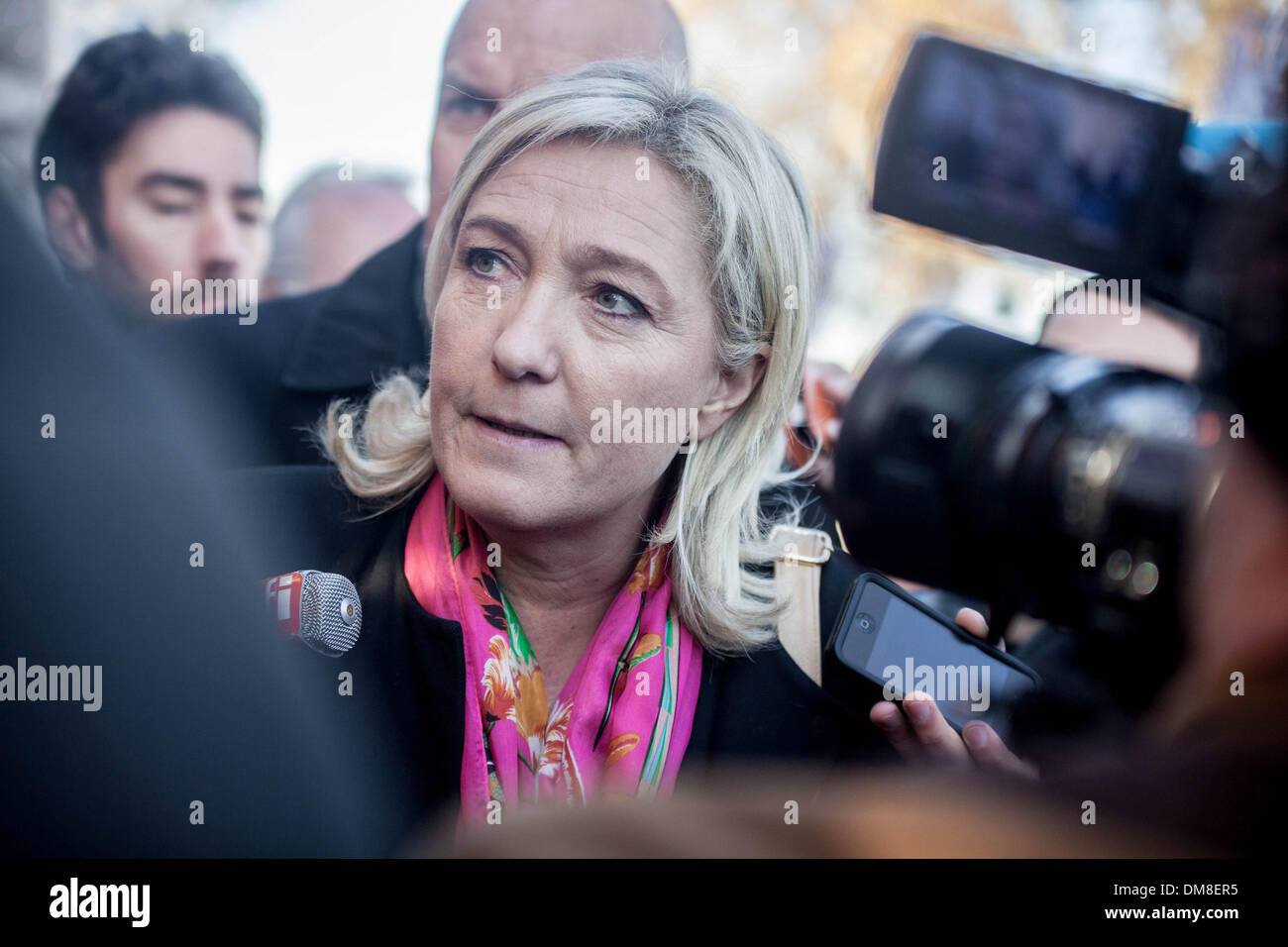 Paris, France. 9th Dec, 2013. Marine Le Pen, president of the National Front, in visit at the Christmas market on the Champs ElysÃƒ©es in Paris, on December 9, 2013.Photo: Michael Bunel/NurPhoto © Michael Bunel/NurPhoto/ZUMAPRESS.com/Alamy Live News Stock Photo