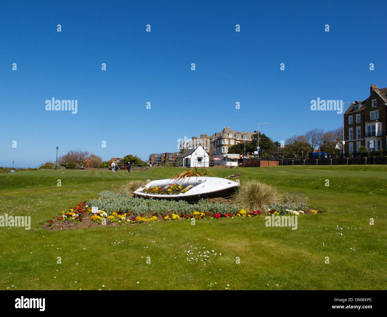 Flower beds incorporating an old boat along the front at Hunstanton