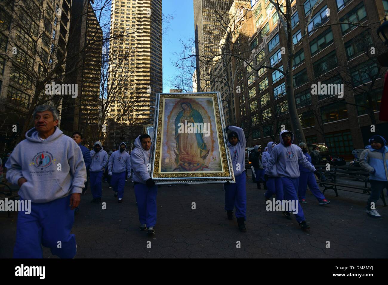 New York, USA. 12th Dec, 2013. Antorcha Guadalupana runners , parade an image of Virgin of Guadalupe at Park Dag HammarskjÌ¦ld, after celebrations at St. Patrick's Cathedral in New York City, marking the end of the annual 2,700-mile, 87-day relay torch run from Puebla, Mexico to New York and the start of the most important religious holiday of the year for Mexicans at home and abroad. December 12 is the annual celebration of the day in 1531 that the Virgin of Guadalupe appeared to Saint Juan Diego, bringing Catholicism to Mexico. (Credit Image: © Miguel Juarez Lugo/ZUMAPRESS.com) Stock Photo