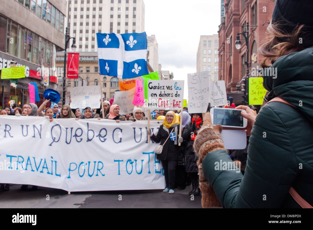 Citizen Journalist recording demonstration in Montreal on phone Stock Photo