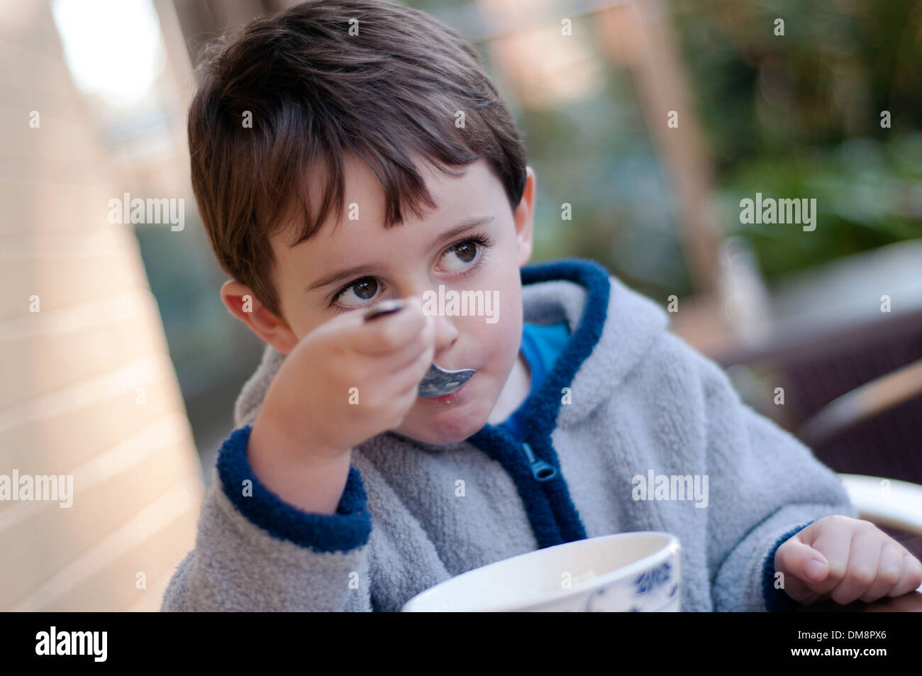 Four years old boy eating ice cream Stock Photo