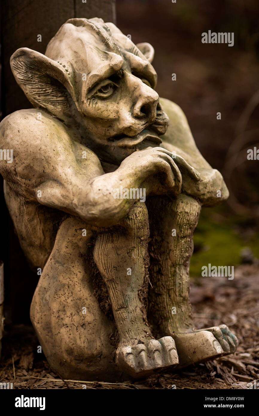 A gargoyle statue sits at the base of a building in Saugerties, New York, on 8 April 2013 Stock