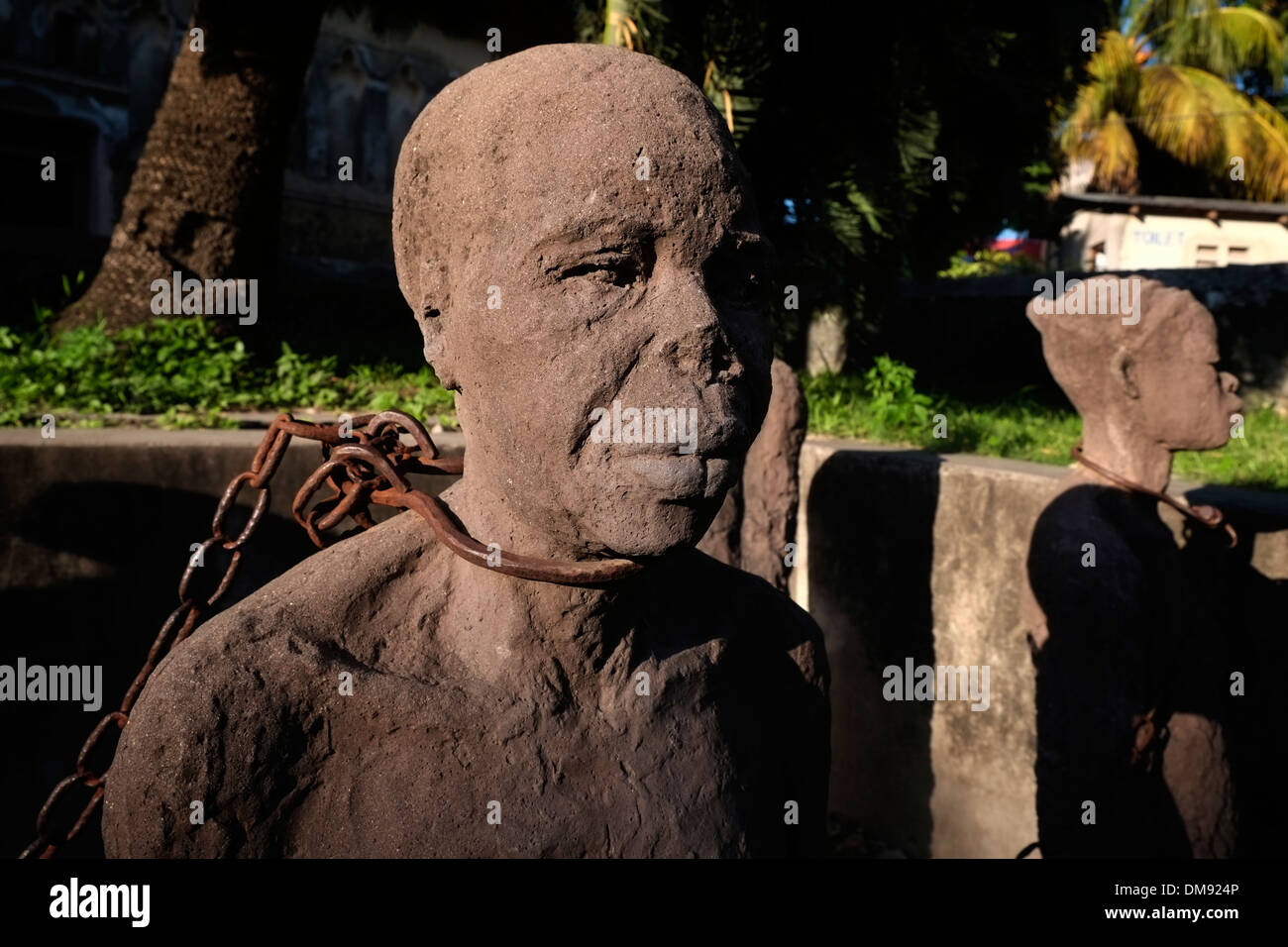 A sculpture depicting a slave with a chain over his neck at the former