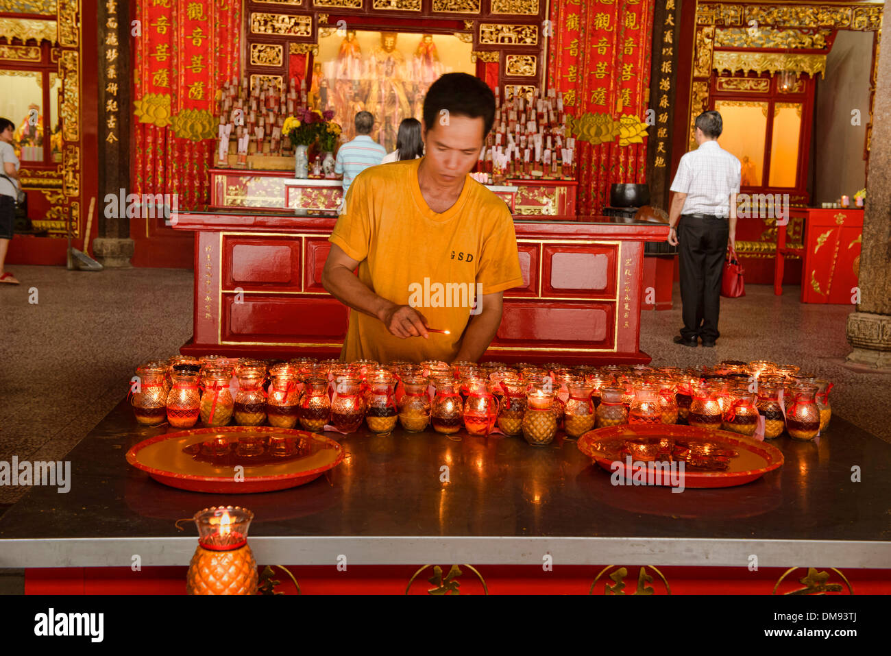 lighting candles for luck in Kong Hock Keong Shrine in in