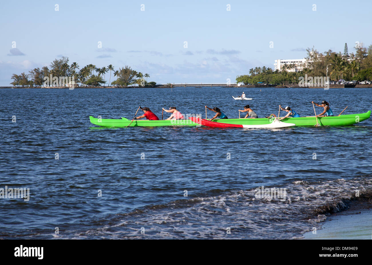 Canoe club practice races on Hilo Bay, Hawaii. Stock Photo