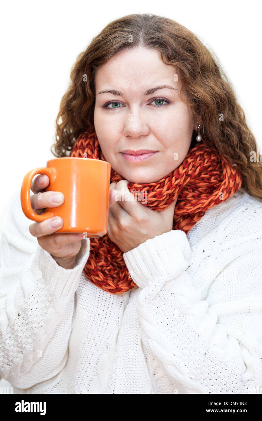 Woman with a sore throat drinking hot tea from a cup, isolated on white