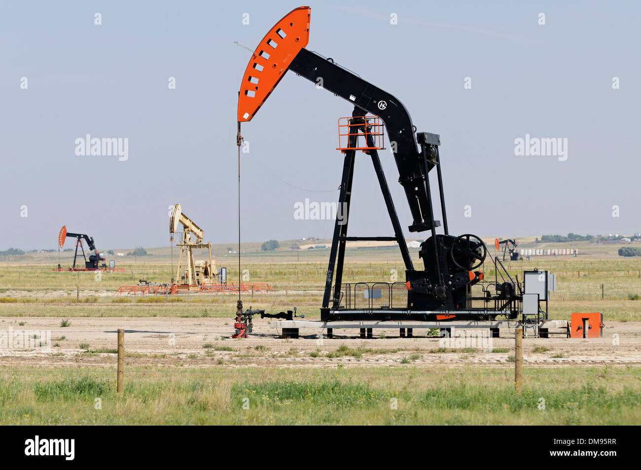Oilpatch pumpjacks pump crude oil from an oilfield near Shaunavon, Saskatchewan, Canada. Stock Photo