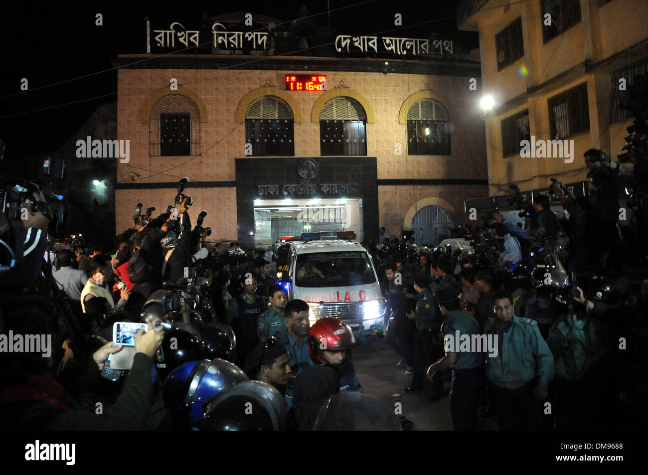 Dhaka, Bangladesh. 12th Dec, 2013. Body of Abdul Quader Molla who is a leader of Bangladesh Jamaat-e-Islami Party is carried by an ambulance after the death sentence in Dhaka, Bangladesh, Dec. 12, 2013. Bangladesh has executed Abdul Quader Molla, an Islamist party leader convicted of war crimes in 1971, which is the first execution of a war criminal in the country. In protest against Molla's execution, his party Jamaat called countrywide dawn-to-dusk general strike for Sunday. Credit:  Shariful Islam/Xinhua/Alamy Live News Stock Photo