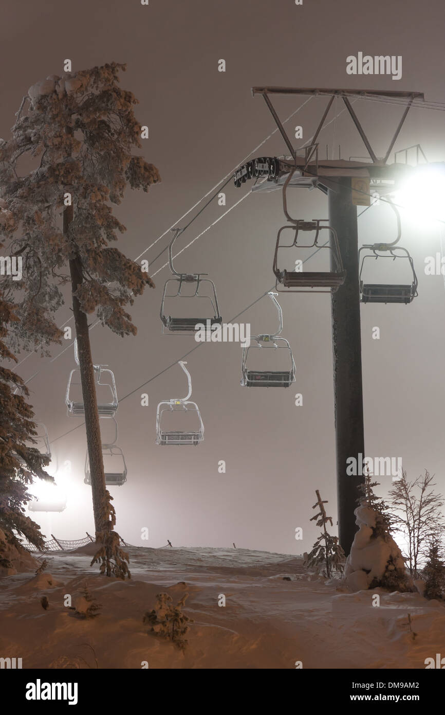 Ski elevator or lift at illuminated night Stock Photo