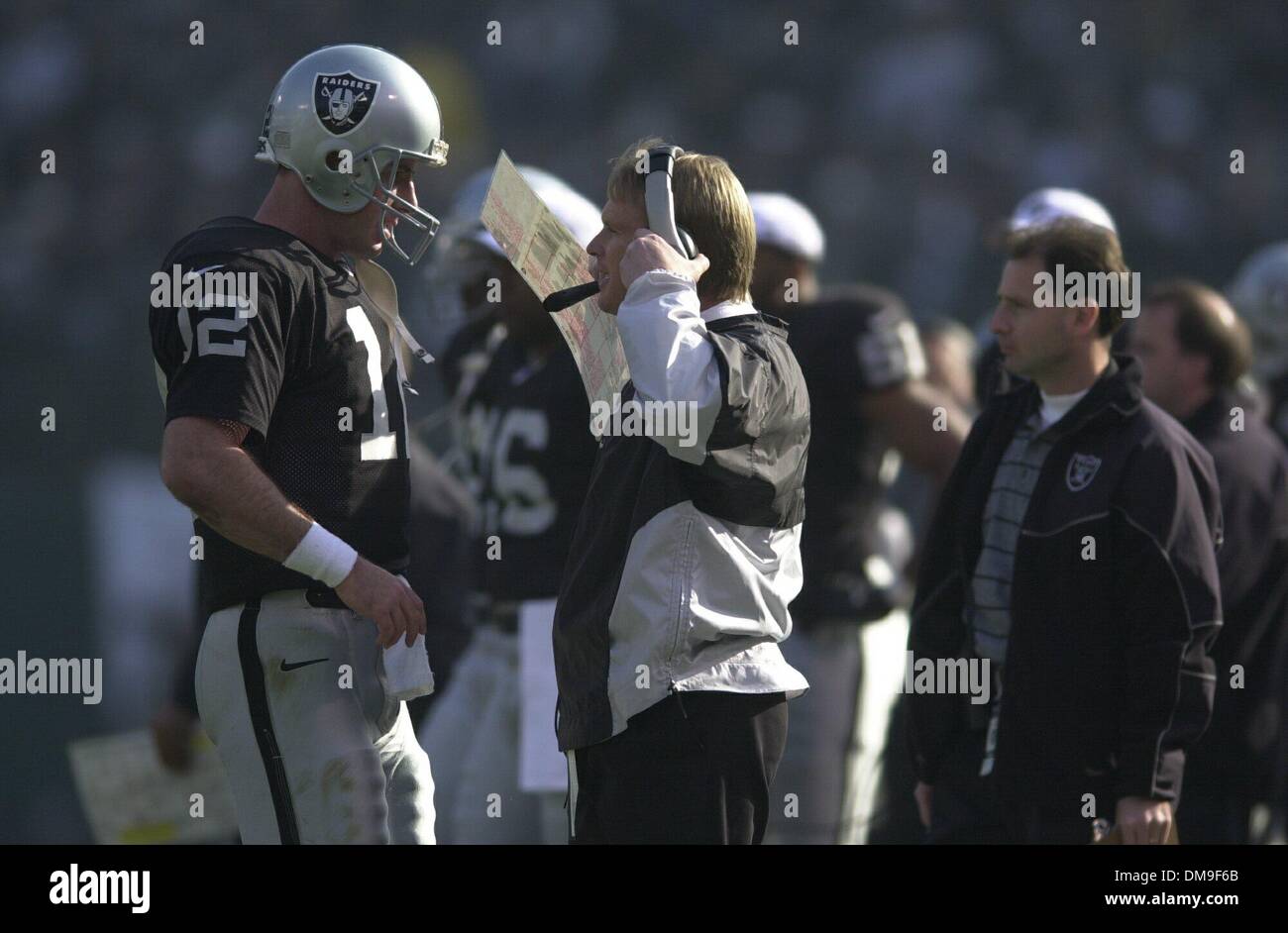 Oakland Raiders quarterback Rich Gannon talks to head coach Jon Gruden  during warm ups prior to a wild card playoff game against the New York Jets  at Network Associates Coliseum in Oakland