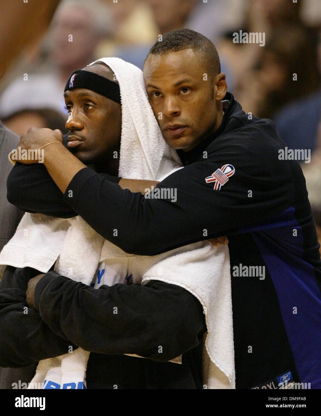 End of the game Lawrence Funderburke (right) and Bobby Jackson stand gloomy on the Kings bench in game four between the Sacramento Kings and the Los Angeles Lakers in the Western Conference Championships Sunday, May 26, 2002 at Staples Center. Sacramento Bee photograph by Bryan Patrick/ZUMA Press Stock Photo