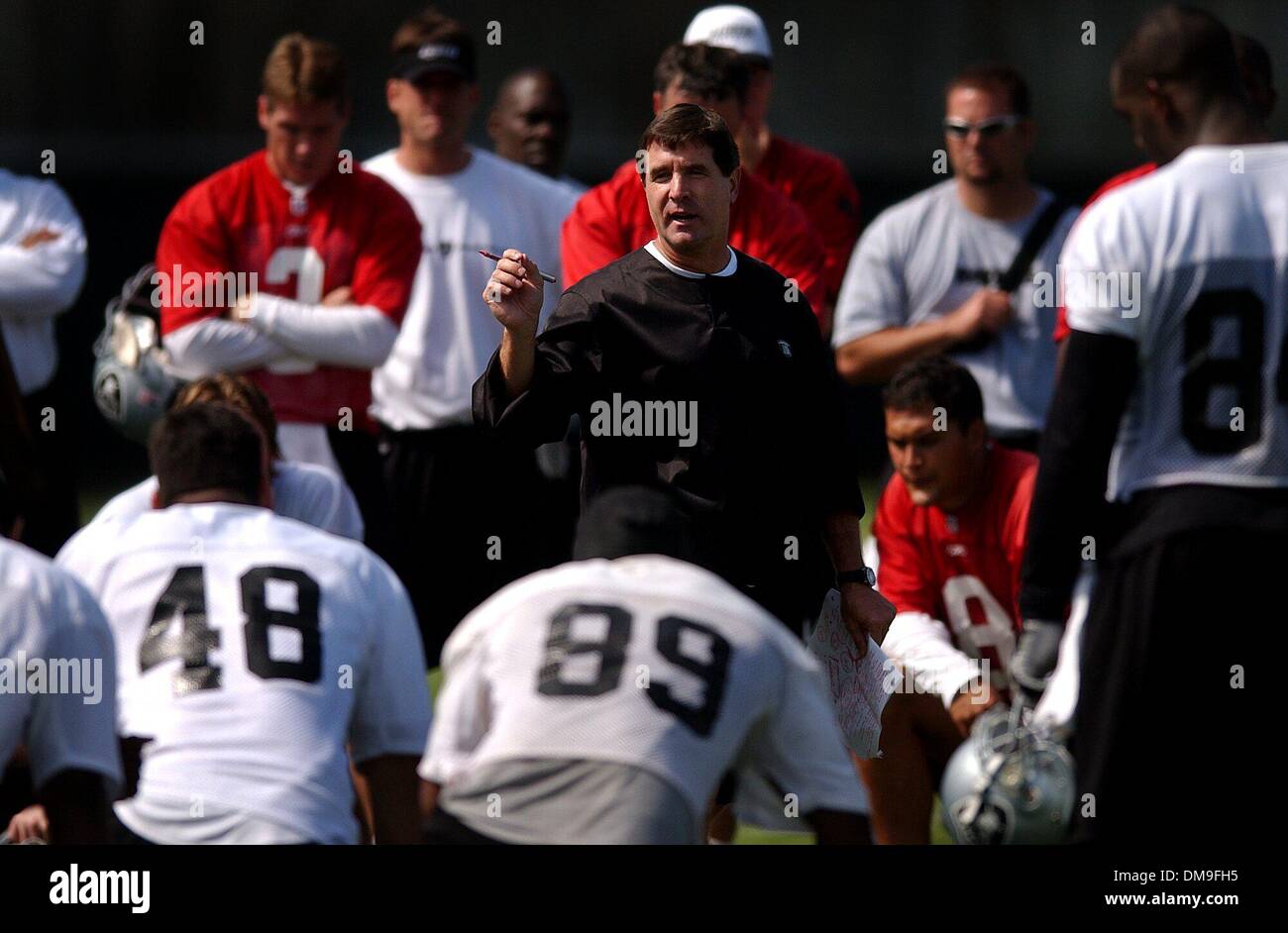 New Oakland Raider head coach Bill Callahan talks with his team following the first day of camp Friday morning at the Oakland Raiders training facility at the Napa Valley Marriott. Sacramento Bee photograph by Jose Luis Villegas July 26, 2002/ZUMA Press Stock Photo