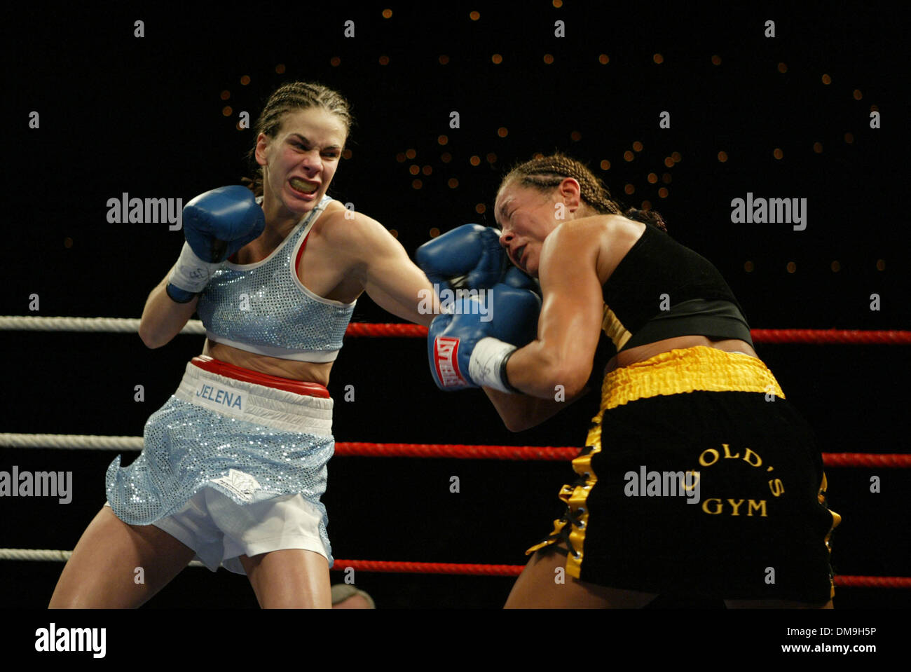 Nov 18, 2005; Edmonton, Alberta, CANADA; Edmonton's very popular Pro boxer  Jr Lightweight JELENA MRDJENOVICH lands a hard left hook to the jaw of USA  Boxer FRANCHESCA ALCANTER which knocked her to