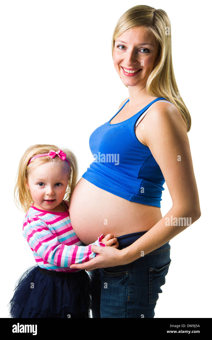 Pregnant Woman With Her Daughter Isolated On White Background Stock pregnant-woman-with-her-daughter-isolated-on-white-background-stock