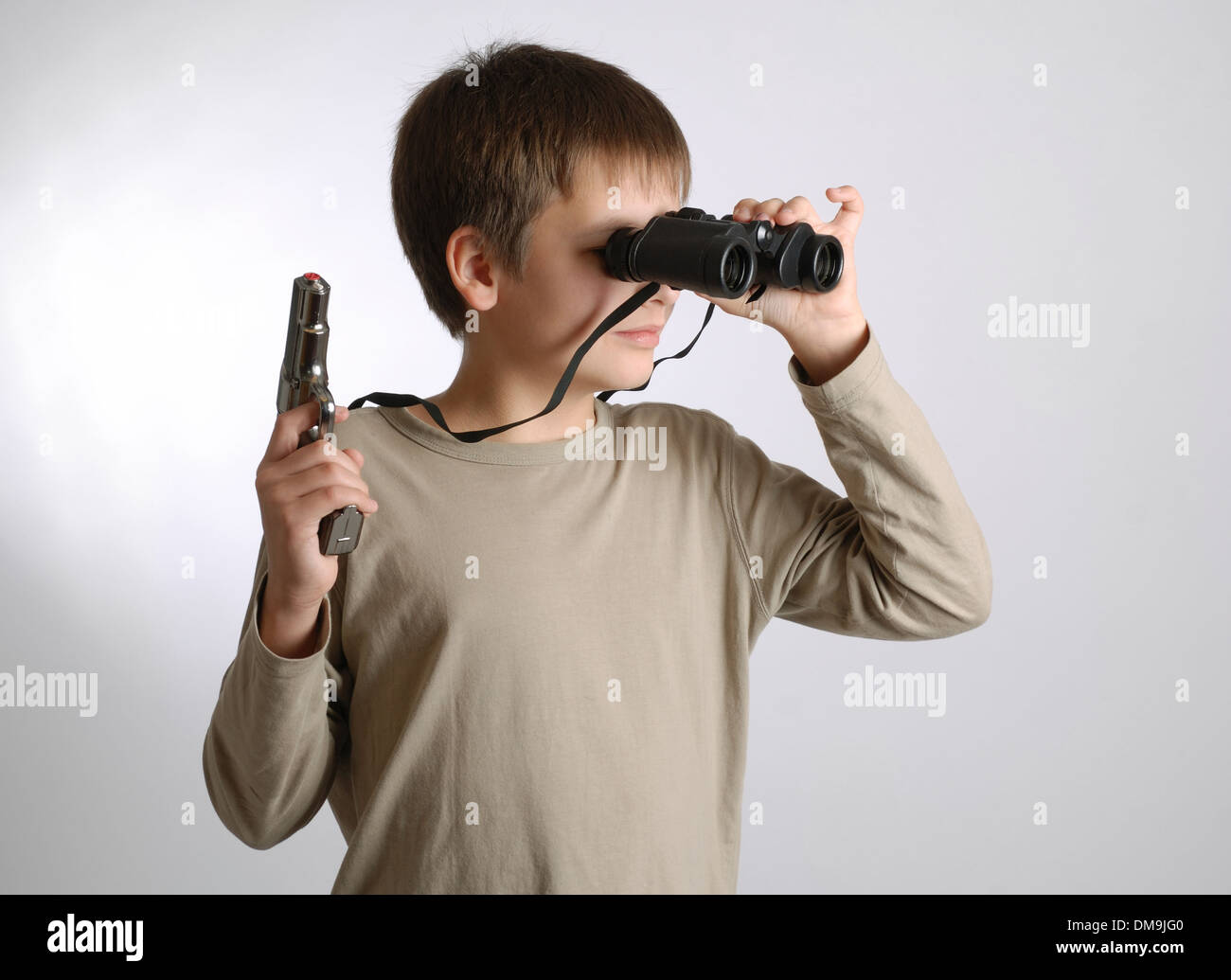 Child with a gun and binoculars Stock Photo Alamy