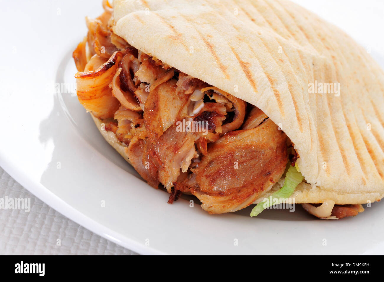a doner kebab in a plate on a set table Stock Photo Alamy