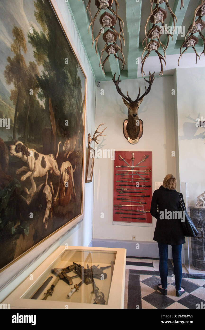 MAIN HALL WITH ITS PAINTINGS AND HUNTING TROPHIES, LA VENERIE MUSEUM CREATED STARTING IN 1935 IN THE OLD SAINT-MAURICE PRIORY, PARK OF THE ROYAL CHATEAU, SENLIS, OISE (60), FRANCE Stock Photo