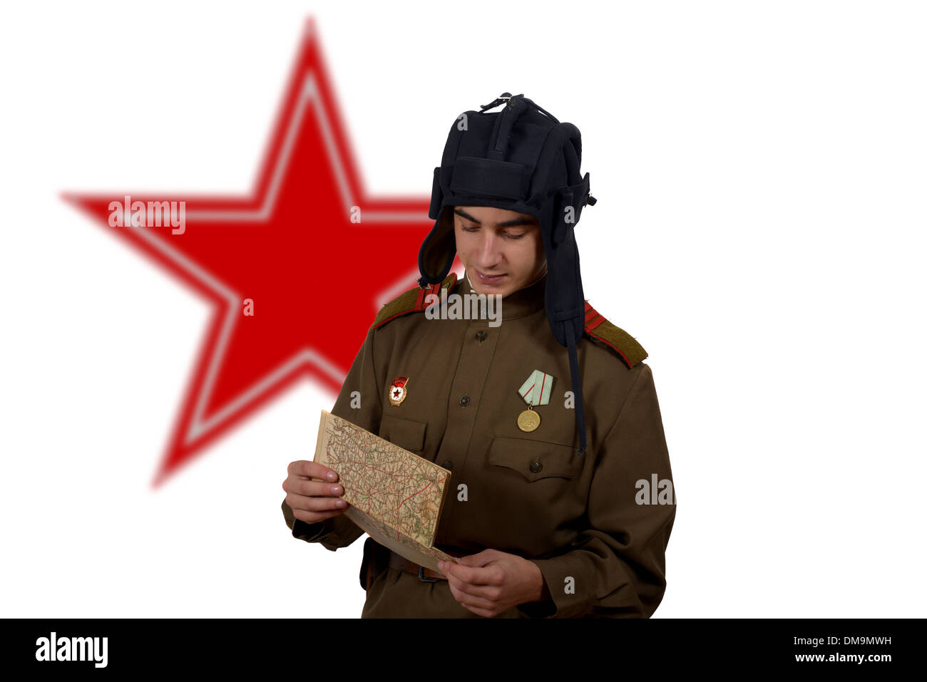 young Soviet tanker look at a map,he have a tank helmet Stock Photo - Alamy