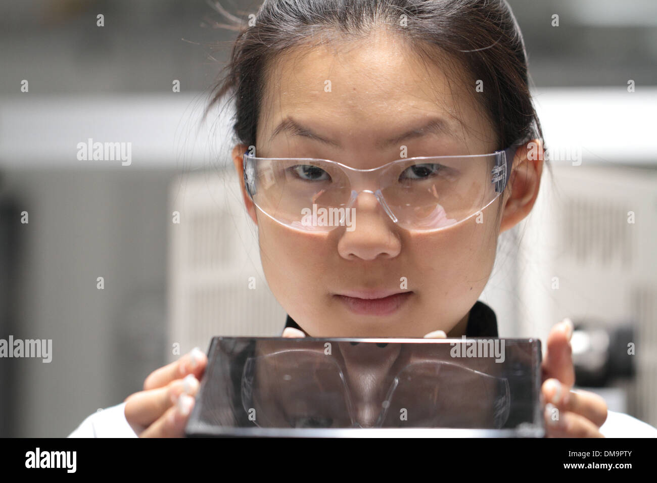 Scientist looking sample in lab hi-res stock photography and images - Alamy