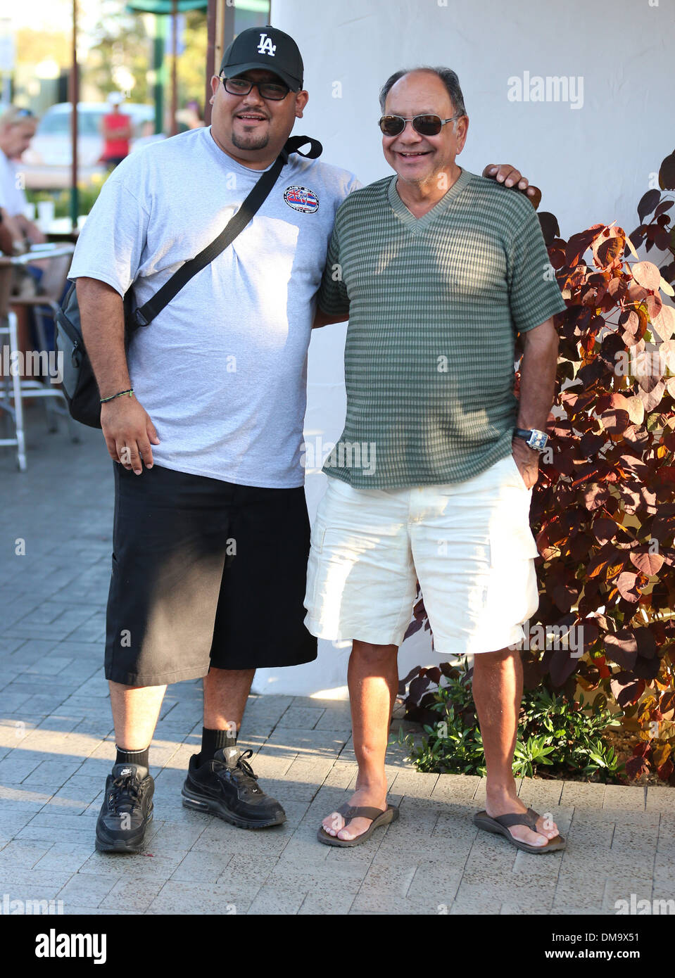 Cheech Marin poses for a picture with a fan whilst visiting Malibu