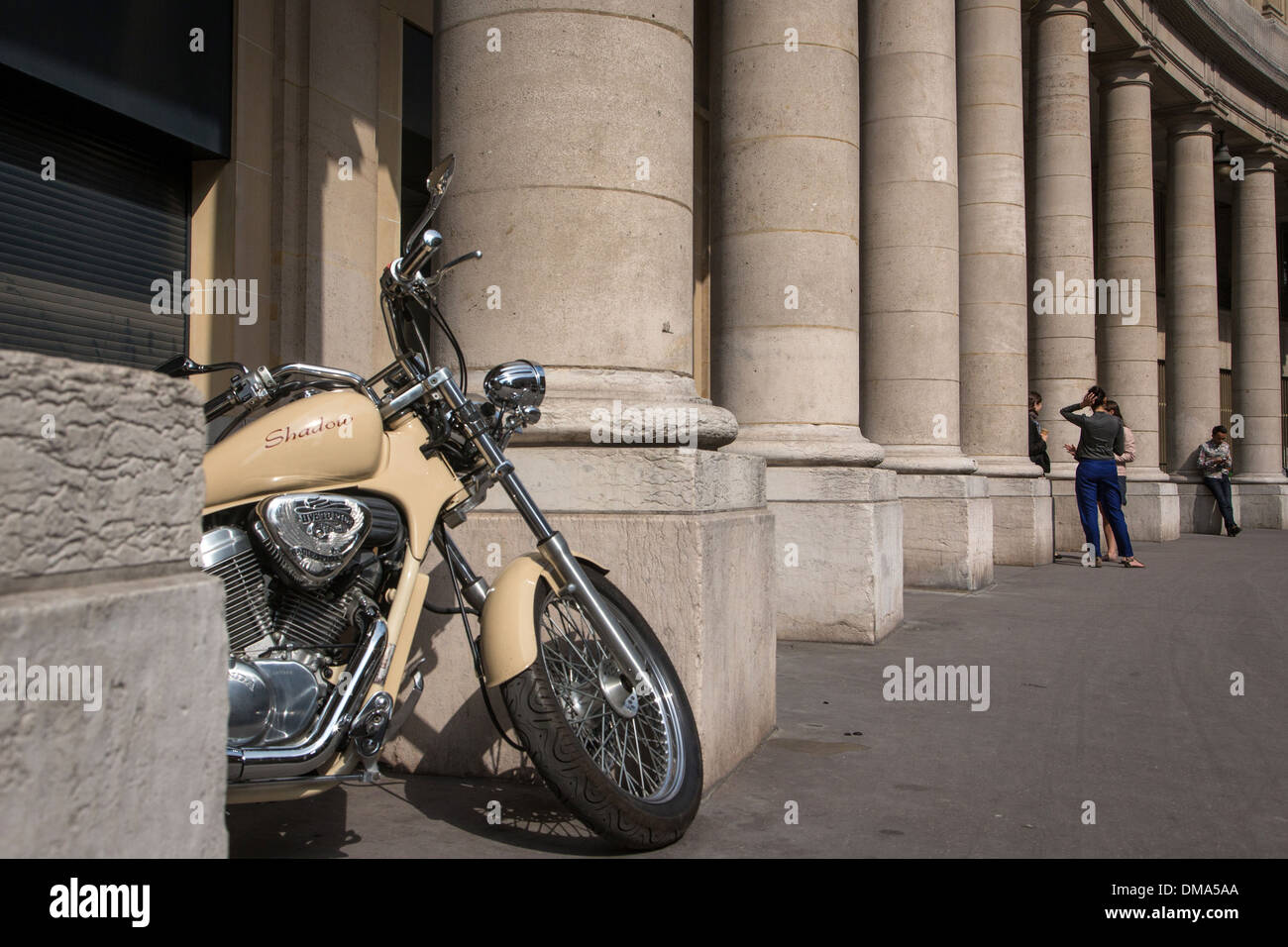 MOTORCYCLE IN FRONT OF A COLUMNED BUILDING ON RUE SAUVAL, PARIS (75), FRANCE Stock Photo