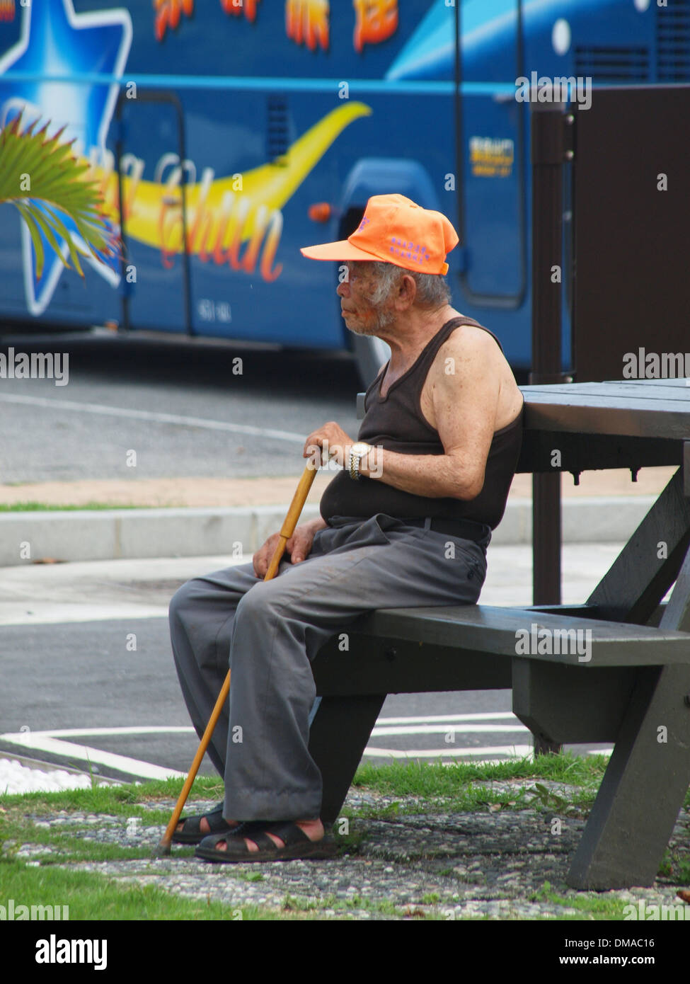 Old Man is waiting for a bus Stock Photo