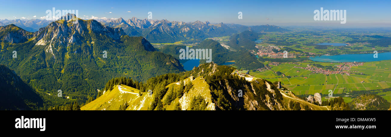 rural panorama landscape with lake Forggensee and alps mountains in Bavaria, Germany, nearby city Fuessen Stock Photo
