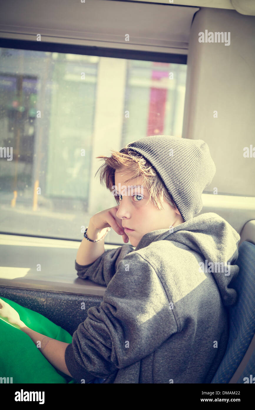 portrait of a teenager boy with toque, sitting in a bus Stock Photo - Alamy