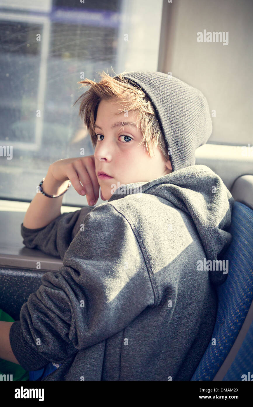 portrait of a teenager boy with toque, sitting in a bus Stock Photo - Alamy
