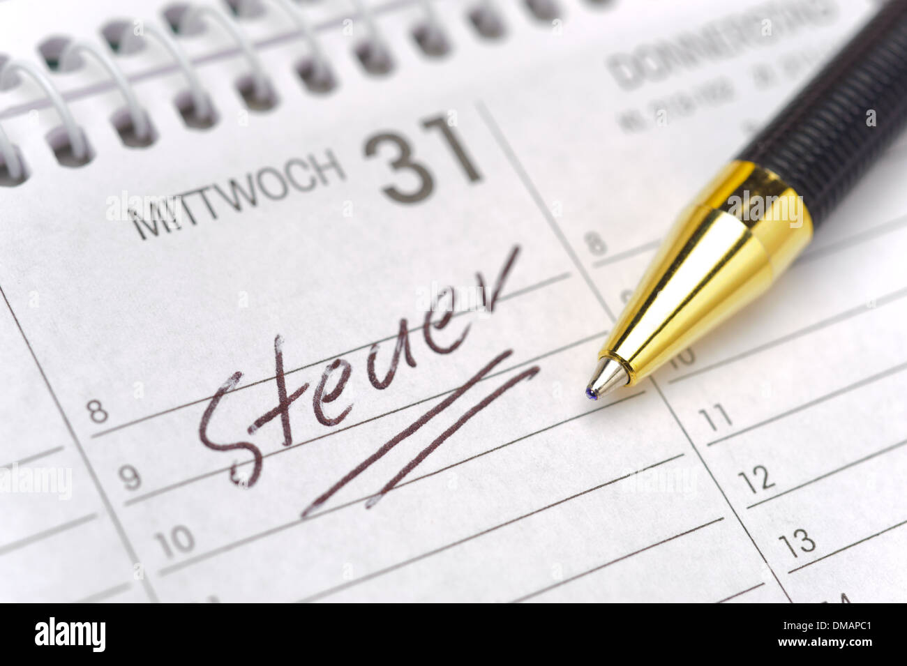 german tax day marked on calendar- tax in german: Steuer Stock Photo