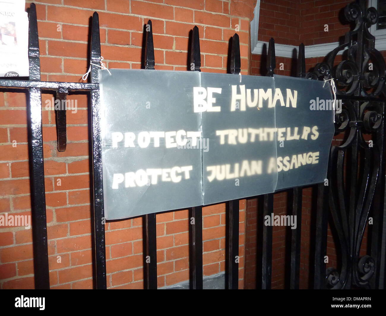 Posters and placards left by protesters outside Ecuadorian Embassy