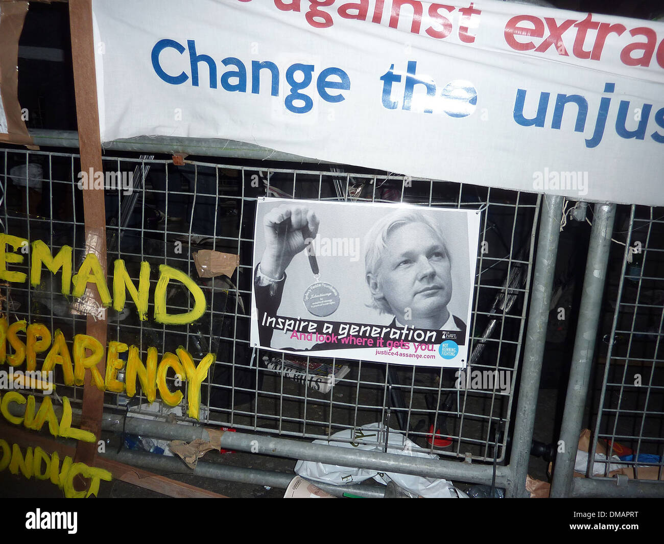 Posters and placards left by protesters outside Ecuadorian Embassy