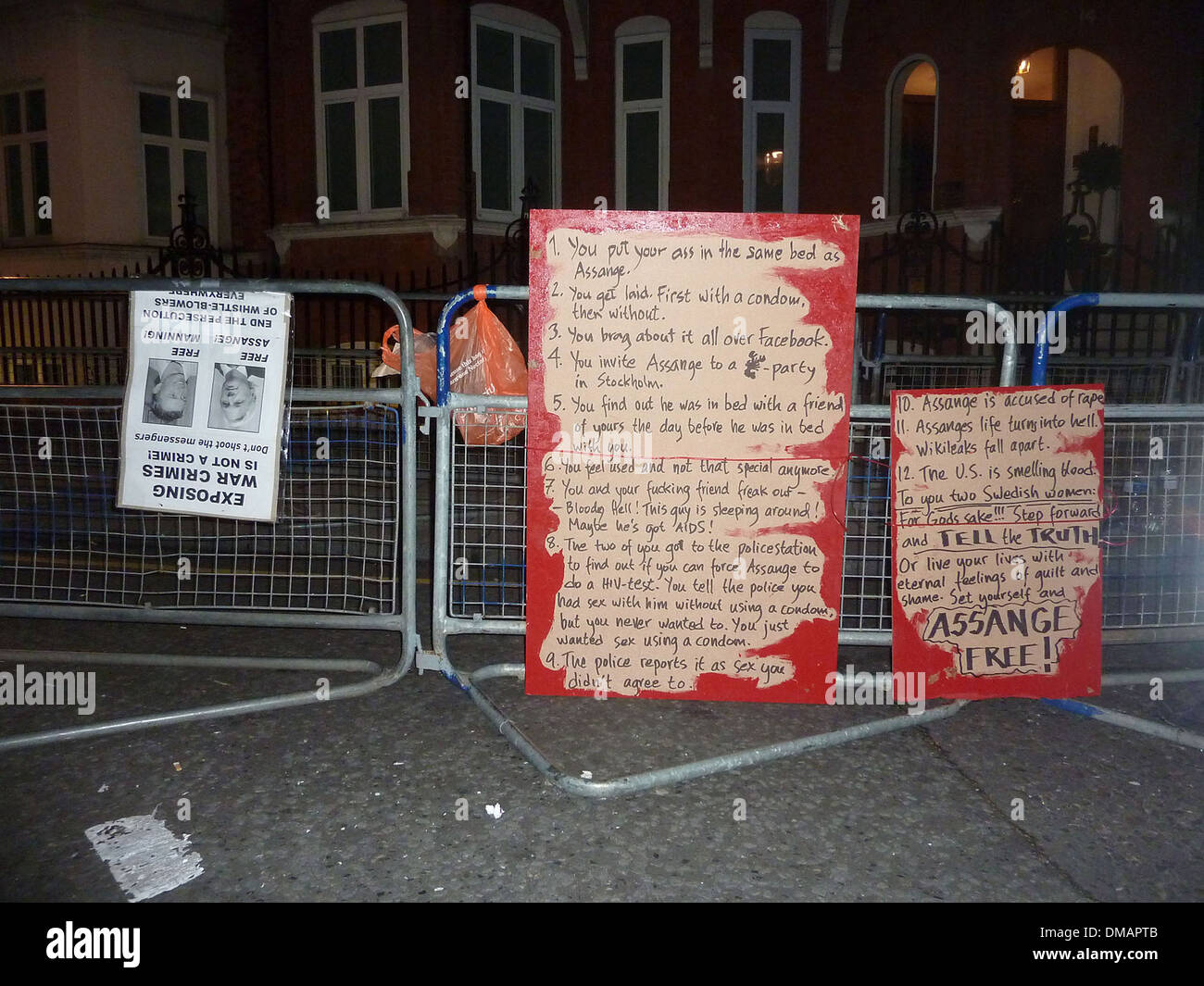 Posters and placards left by protesters outside Ecuadorian Embassy