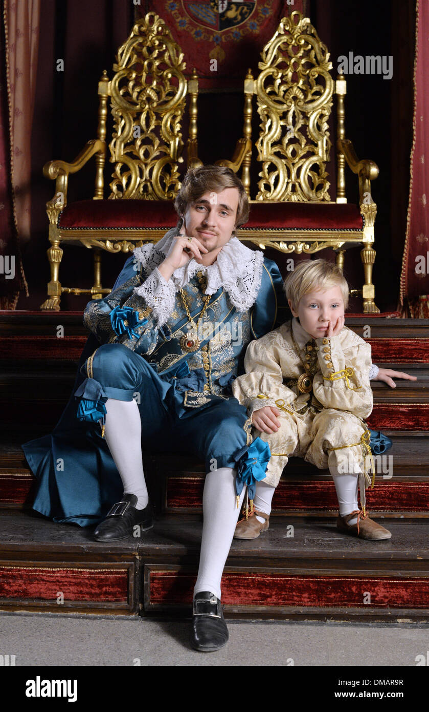 Budapest, Hungary. 11th Dec, 2013. (dpa-EXCLUSIVE) Actor Constantin von Jascheroff as Prince of Wales poses with his son Elias (5) in a matching outfit at the set of TV series 'Alatriste' in Budapest, Hungary, 11 December 2013. The 15 episodes, set at the Spanish royal court at the beginning of the 17th century are produced after the series of novels 'Capitain Alatriste' by Spanish author Arturo Pérez-Reverte, are produced by Beta Film for German-French TV channel Arte. Photo: Jens Kalaene/dpa/Alamy Live News Stock Photo