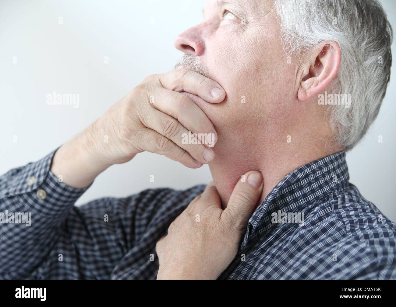 man with throat or neck problems Stock Photo