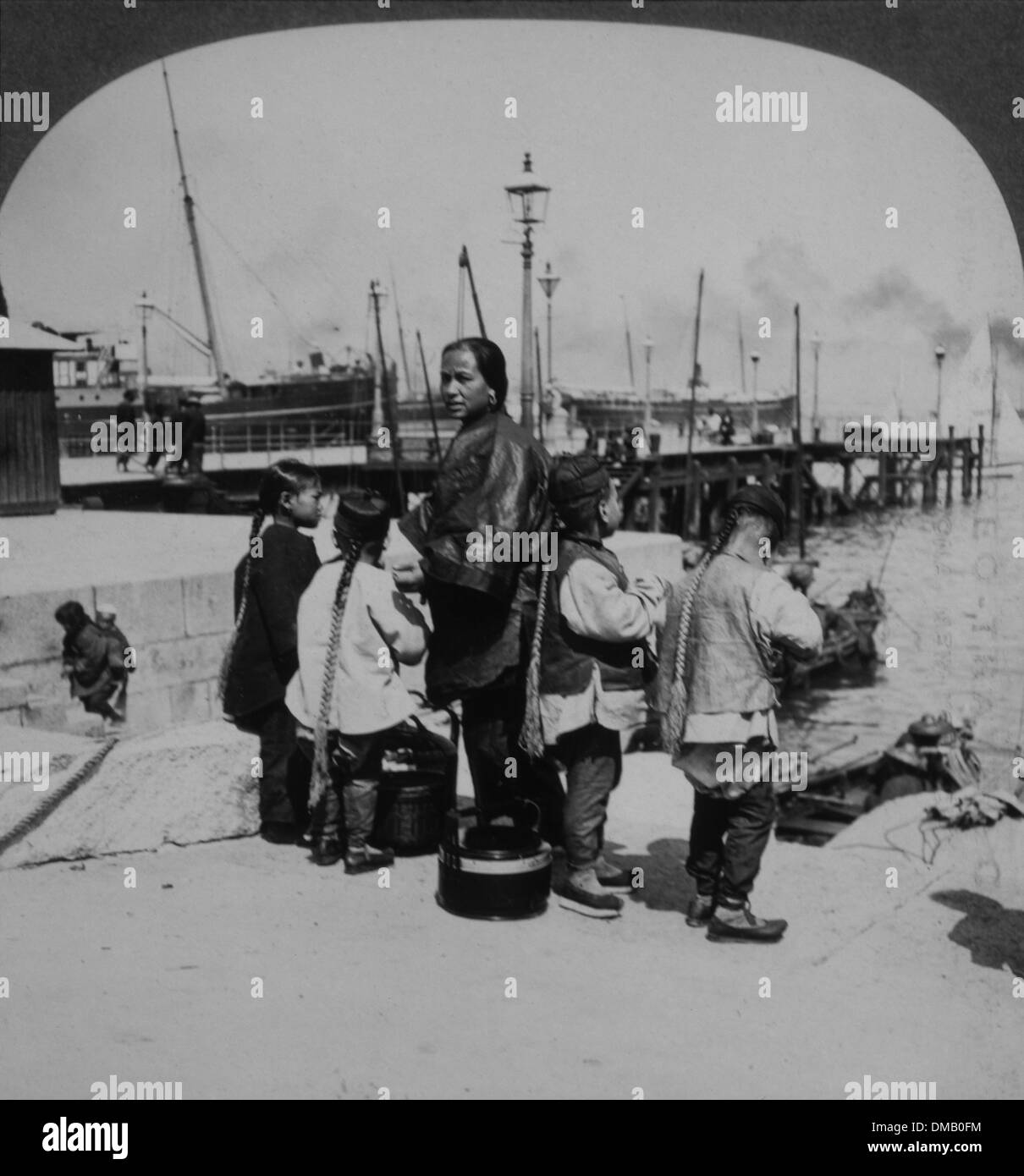 Chinese Woman and Children on Wharf, Hong Kong, 1910 Stock Photo