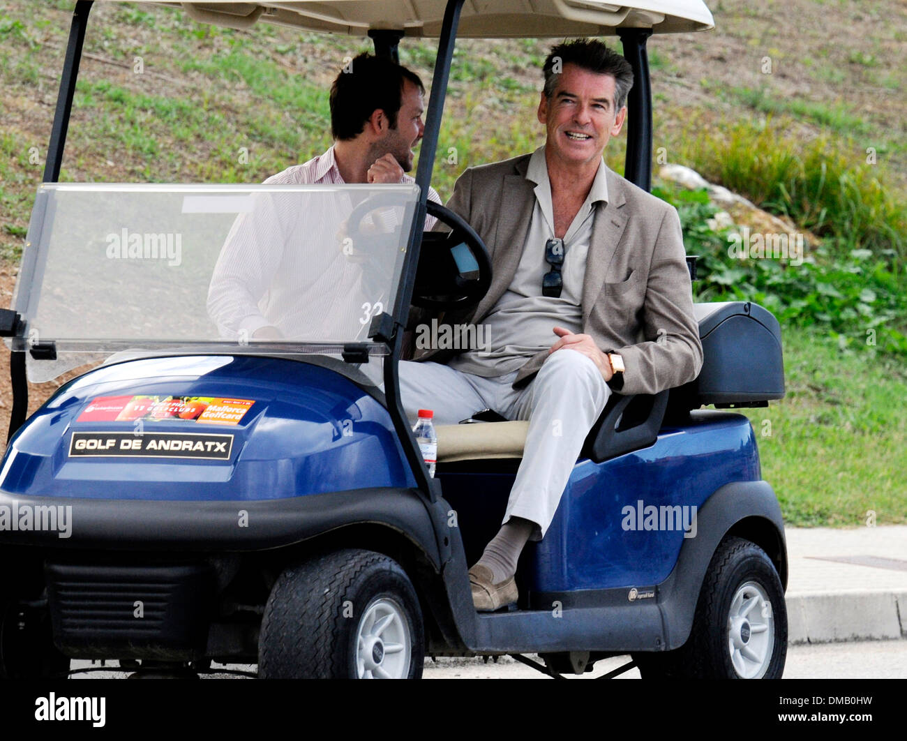 Pierce Brosnan strolling with a golf cart in Mallorca. Stock Photo