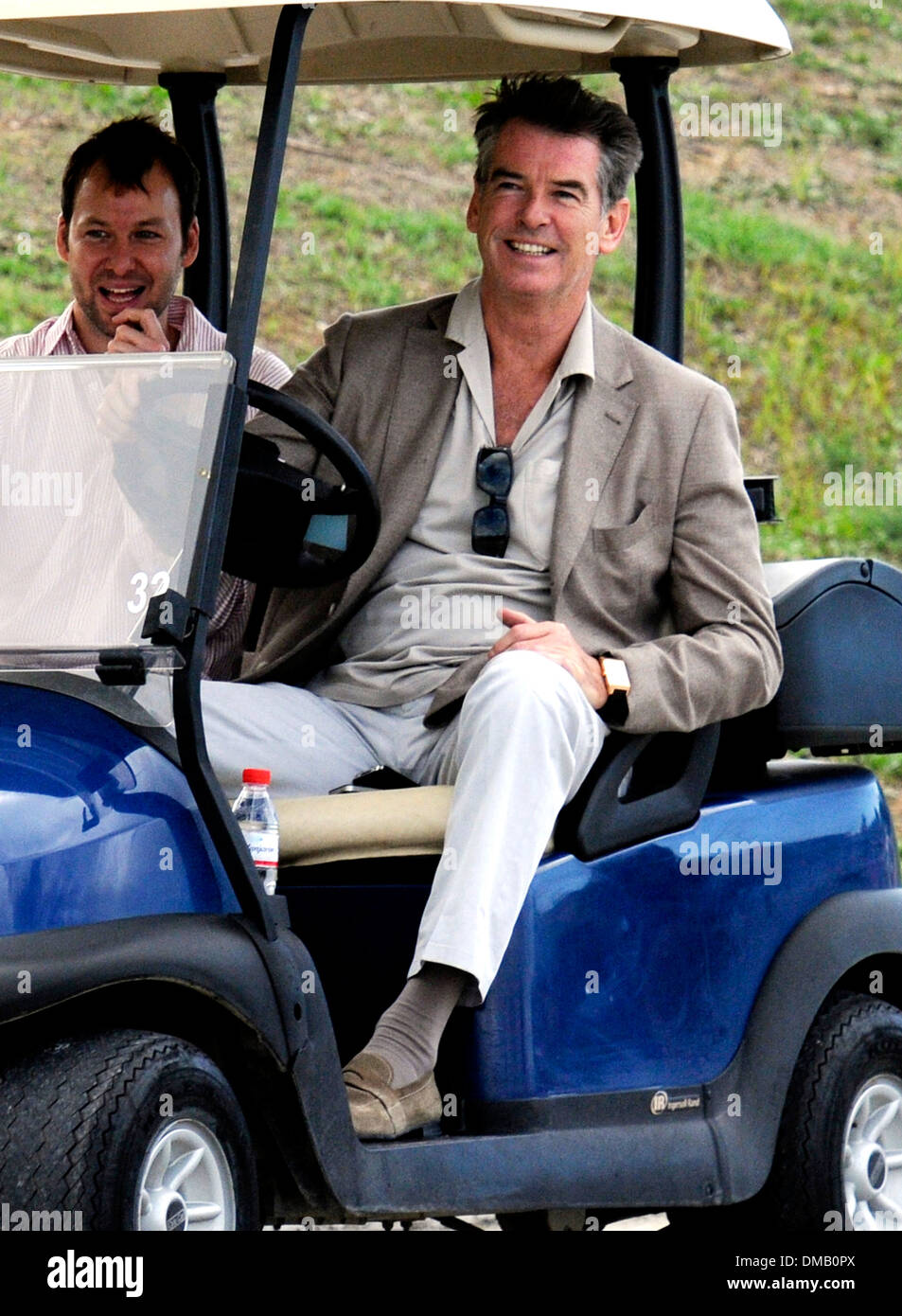 Pierce Brosnan strolling with a golf cart in Mallorca. Stock Photo