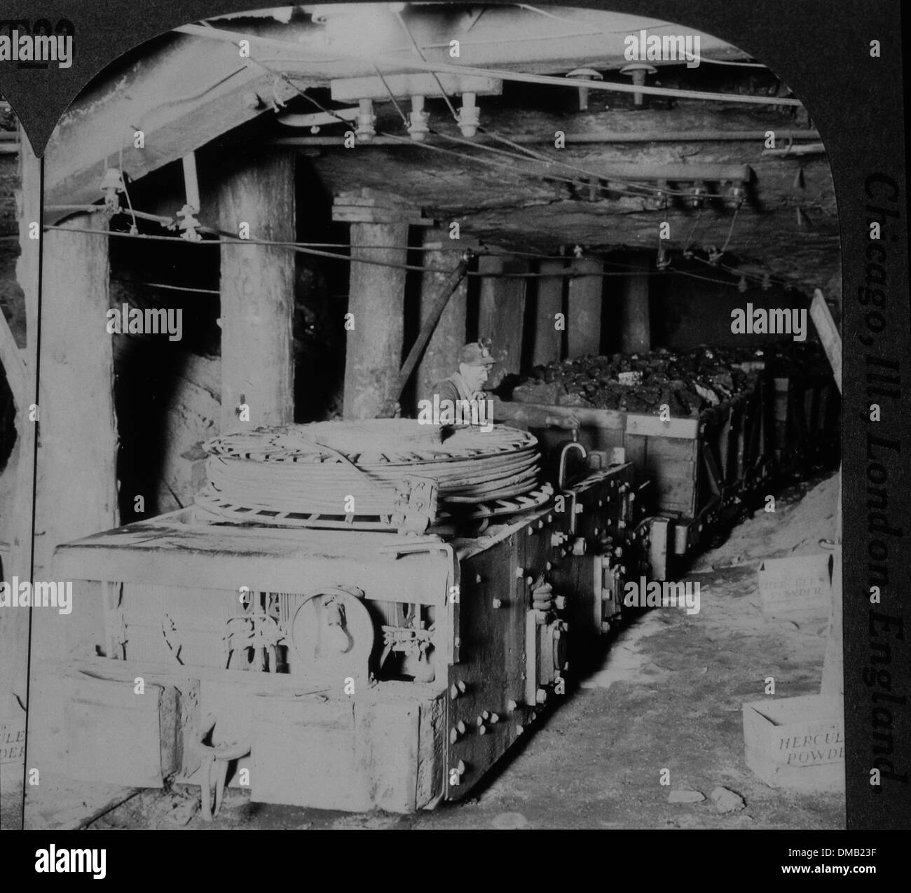 Worker Operating Electric Motor Hauling Coal Cars to Floor of Mine Shaft, near Scranton, Pennsylvania, USA, 1905 Stock Photo