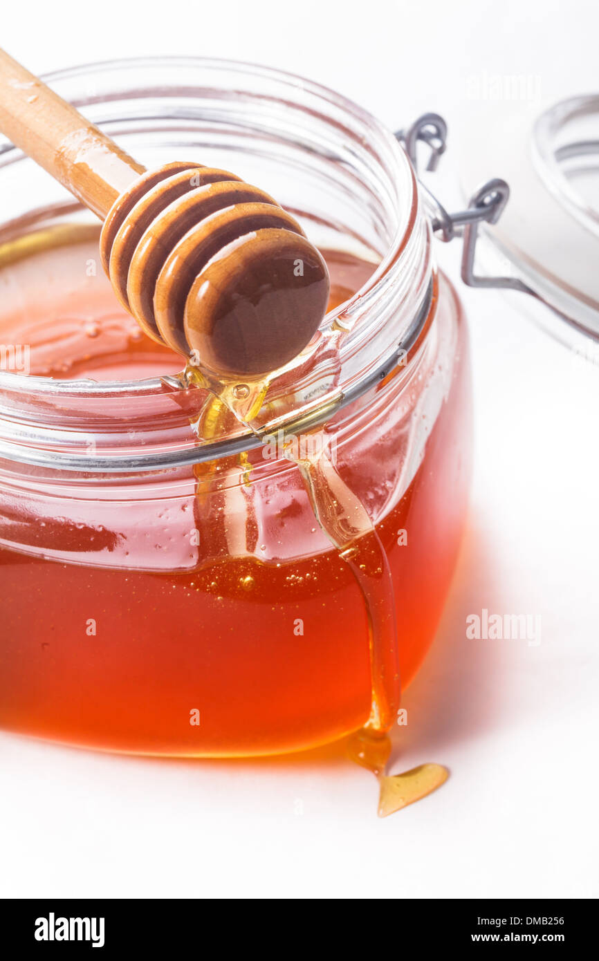 Honey drip and jar on white backround Stock Photo Alamy
