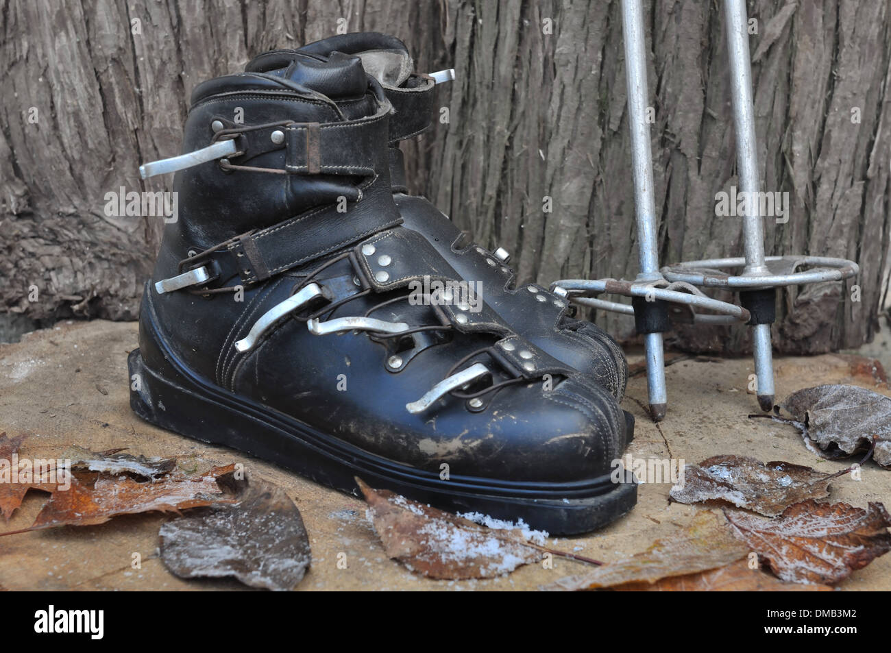old ski boots in a rustic wooden setting Stock Photo